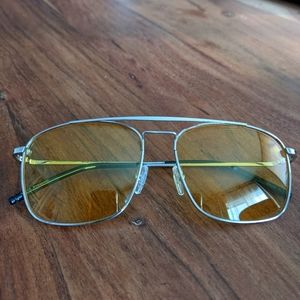 Yellow tinted sunglasses with silver frame